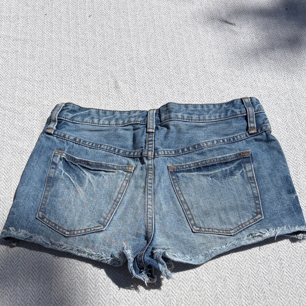 Free People Distressed Light Blue Denim Cutoff Shorts.  Size 28